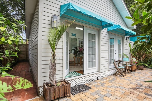 827 Port St, New Orleans, LA 70117 - property entrance with a patio area and french doors