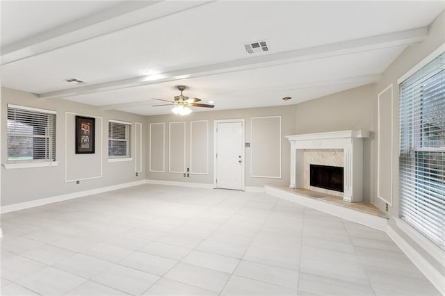 4480 Lennox Blvd, New Orleans, LA 70131 - unfurnished living room with beam ceiling, a ceiling fan, a premium fireplace, and light tile patterned floors