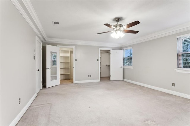 4480 Lennox Blvd, New Orleans, LA 70131 - unfurnished bedroom featuring ornamental molding, a walk in closet, light colored carpet, and ceiling fan