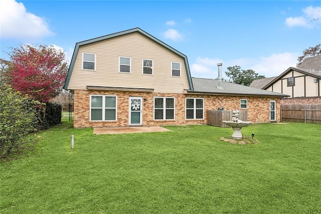 4480 Lennox Blvd, New Orleans, LA 70131 - back of property featuring a gambrel roof, brick siding, a fenced backyard, and a patio