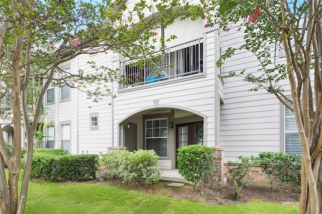350 Emerald Forest Blvd Unit 6101, Covington, LA 70433 - rear view of property featuring a balcony and a yard