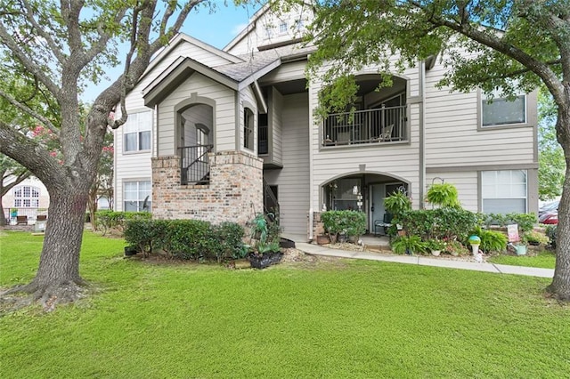 350 Emerald Forest Blvd Unit 6101, Covington, LA 70433 - view of front of house with a front lawn and brick siding