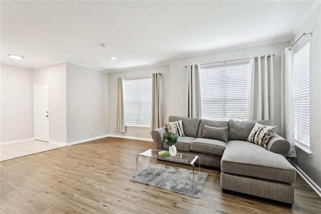 350 Emerald Forest Blvd Unit 6101, Covington, LA 70433 - living room with crown molding, wood finished floors, plenty of natural light, and recessed lighting