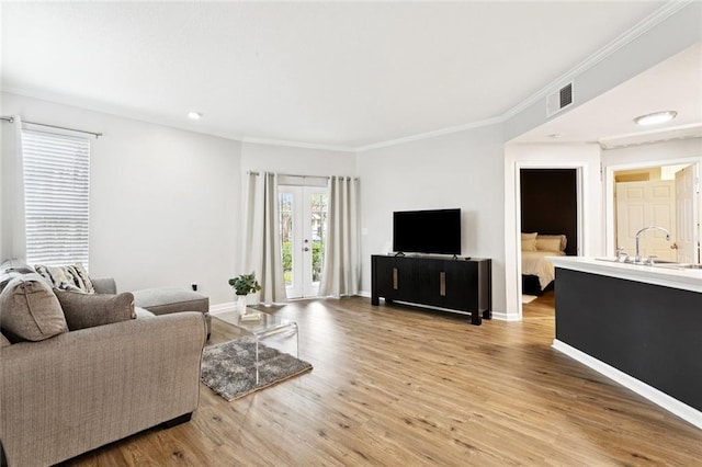 350 Emerald Forest Blvd Unit 6101, Covington, LA 70433 - living room with wood finished floors, crown molding, and recessed lighting