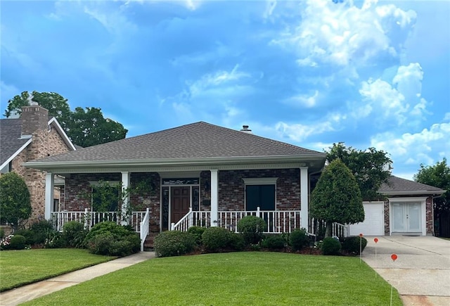 725 Marlene Dr, Gretna, LA 70056 - view of front of property with driveway, a porch, a front yard, and brick siding