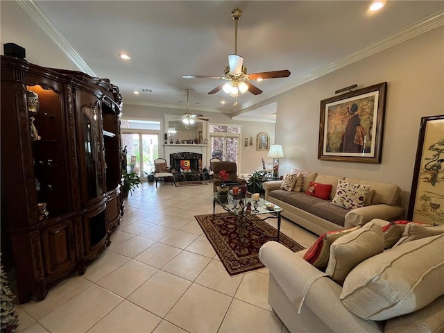 725 Marlene Dr, Gretna, LA 70056 - living room featuring ceiling fan, a tiled fireplace, light tile patterned floors, crown molding, and recessed lighting