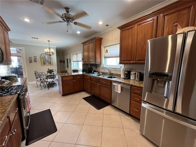 725 Marlene Dr, Gretna, LA 70056 - kitchen featuring stainless steel appliances, ceiling fan, crown molding, light tile patterned flooring, and a peninsula
