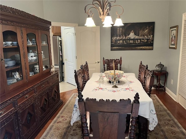 725 Marlene Dr, Gretna, LA 70056 - dining area with wood finished floors and a chandelier