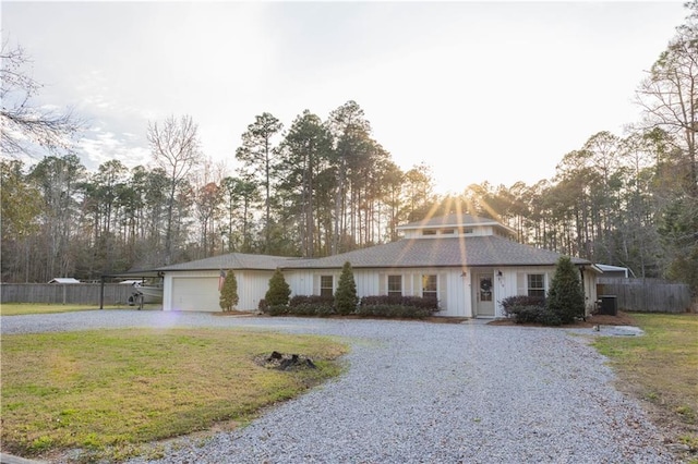 119 Ivy Dr, Covington, LA 70433 - view of front of property featuring driveway, a carport, board and batten siding, and view of scattered trees