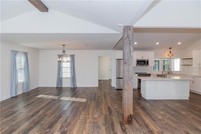 119 Ivy Dr, Covington, LA 70433 - living room featuring high vaulted ceiling, dark wood-style flooring, beam ceiling, plenty of natural light, and recessed lighting