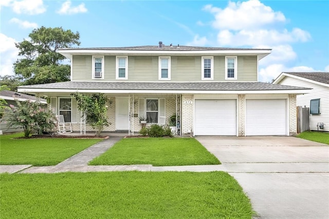 872 Bellemeade Blvd, Gretna, LA 70056 - view of front of home with concrete driveway, brick siding, a front yard, covered porch, and an attached garage