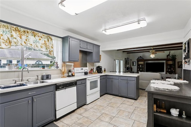 872 Bellemeade Blvd, Gretna, LA 70056 - kitchen with white appliances, gray cabinets, plenty of natural light, and a peninsula