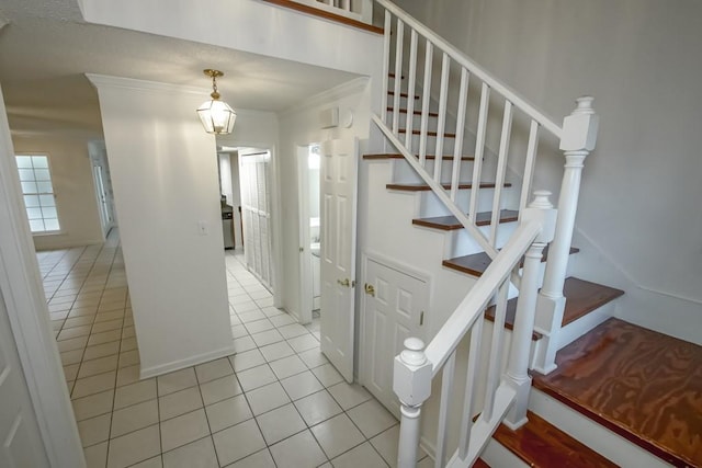3320 Taft Park Unit C, Metairie, LA 70002 - stairway with tile patterned flooring and crown molding