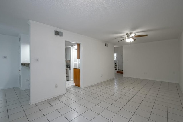 3320 Taft Park Unit C, Metairie, LA 70002 - unfurnished room featuring ceiling fan, light tile patterned floors, and a textured ceiling