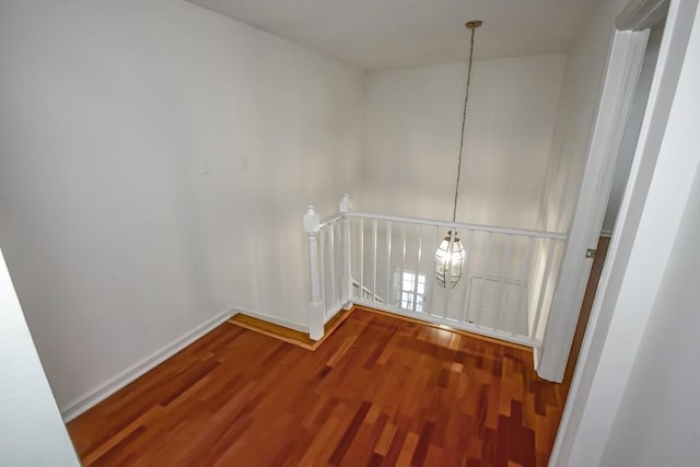 3320 Taft Park Unit C, Metairie, LA 70002 - hallway with an upstairs landing, wood finished floors, and a chandelier