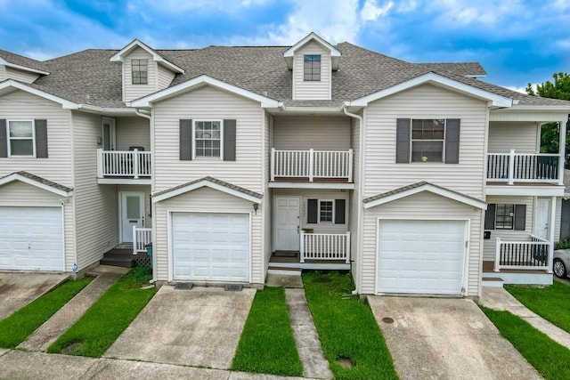3320 Taft Park Unit C, Metairie, LA 70002 - view of front of property featuring a balcony, a shingled roof, driveway, and an attached garage