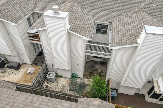 3320 Taft Park Unit C, Metairie, LA 70002 - rear view of property featuring roof with shingles, a chimney, and a balcony