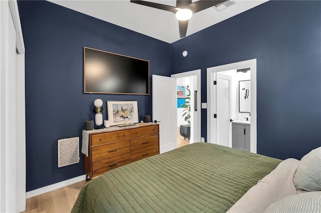 2113 Harmony St, New Orleans, LA 70115 - bedroom featuring wood finished floors, ceiling fan, and ensuite bathroom