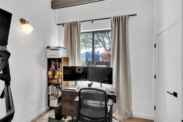 2113 Harmony St, New Orleans, LA 70115 - home office with baseboards and wood finished floors