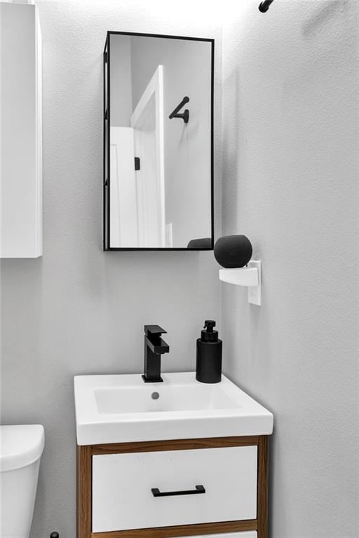 2113 Harmony St, New Orleans, LA 70115 - half bath with vanity and toilet