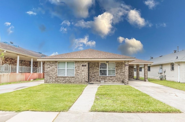 716260 Bunker Hill Rd, New Orleans, LA 70127 - view of front of property with roof with shingles, brick siding, and a front yard