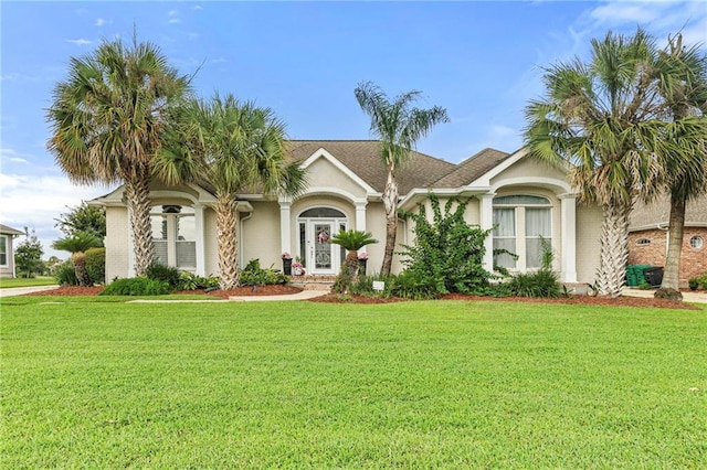 3913 Lake Providence Dr, Harvey, LA 70058 - view of front of house featuring a front lawn and stucco siding
