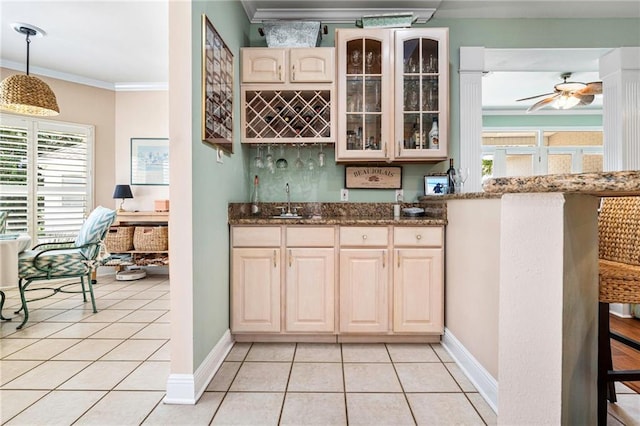 3913 Lake Providence Dr, Harvey, LA 70058 - indoor wet bar featuring ornamental molding, light tile patterned floors, plenty of natural light, a ceiling fan, and decorative light fixtures