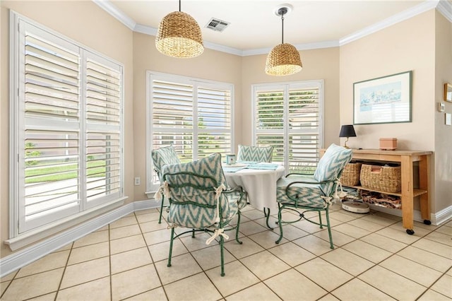 3913 Lake Providence Dr, Harvey, LA 70058 - dining space featuring light tile patterned floors and crown molding