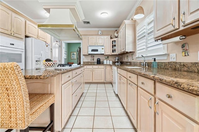 3913 Lake Providence Dr, Harvey, LA 70058 - kitchen featuring light tile patterned flooring, white appliances, ornamental molding, dark stone countertops, and glass insert cabinets