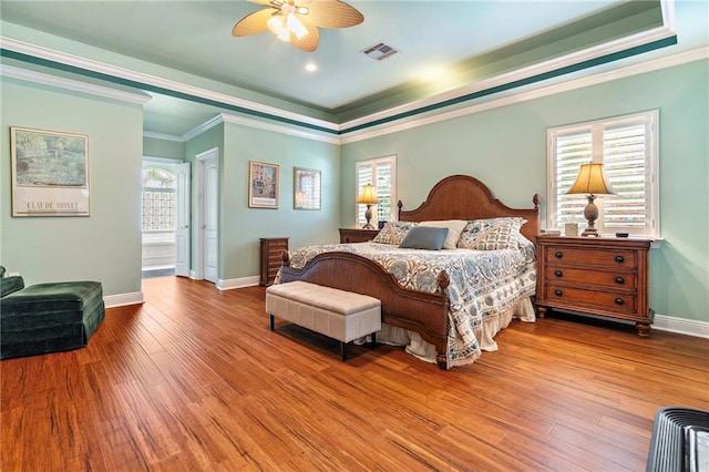 3913 Lake Providence Dr, Harvey, LA 70058 - bedroom with a raised ceiling, wood finished floors, crown molding, and a ceiling fan