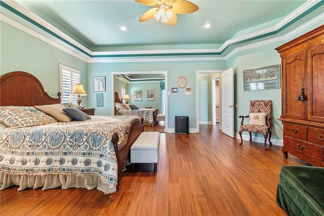 3913 Lake Providence Dr, Harvey, LA 70058 - bedroom with ornamental molding, wood finished floors, ceiling fan, and a raised ceiling