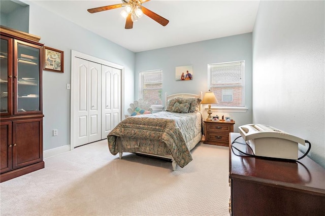 3913 Lake Providence Dr, Harvey, LA 70058 - bedroom featuring light colored carpet, a closet, and ceiling fan