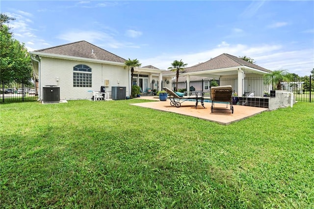 3913 Lake Providence Dr, Harvey, LA 70058 - rear view of property with a patio area, a fenced backyard, roof with shingles, and brick siding