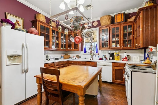 834 Madison St, Gretna, LA 70053 - kitchen featuring white appliances, ornamental molding, a chandelier, light countertops, and glass insert cabinets