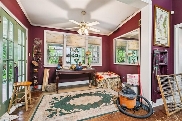 834 Madison St, Gretna, LA 70053 - sitting room with wood finished floors, ornamental molding, and ceiling fan