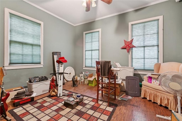 834 Madison St, Gretna, LA 70053 - recreation room featuring wood finished floors, ornamental molding, plenty of natural light, and ceiling fan