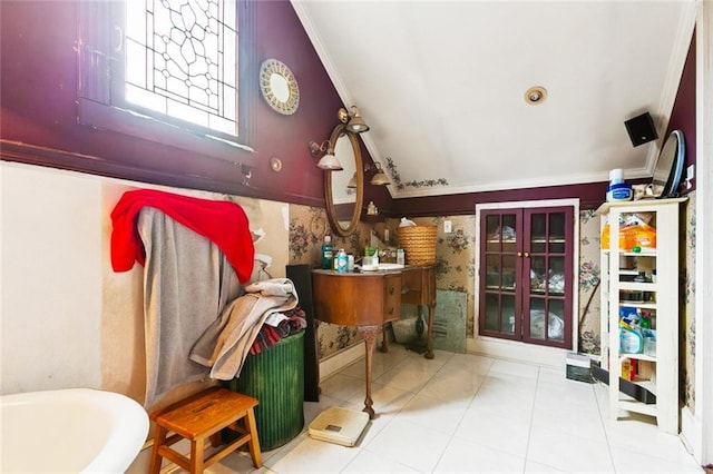 834 Madison St, Gretna, LA 70053 - bathroom featuring ornamental molding, vaulted ceiling, vanity, tile patterned flooring, and a bath