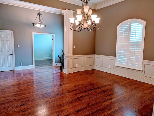 11 Mark Smith Dr, Mandeville, LA 70471 - unfurnished room with ornamental molding, a chandelier, and dark wood-type flooring