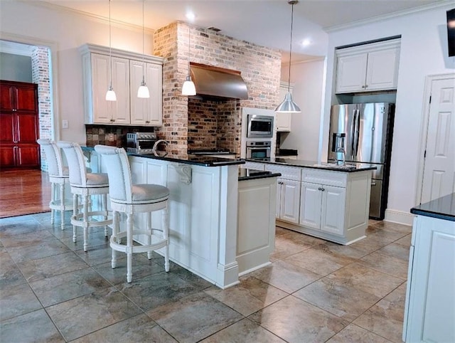 11 Mark Smith Dr, Mandeville, LA 70471 - kitchen featuring dark countertops, a peninsula, appliances with stainless steel finishes, ventilation hood, and white cabinets