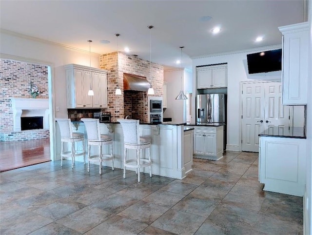 11 Mark Smith Dr, Mandeville, LA 70471 - kitchen featuring a peninsula, dark countertops, ornamental molding, a kitchen breakfast bar, and wall chimney range hood
