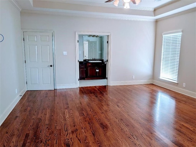 11 Mark Smith Dr, Mandeville, LA 70471 - spare room with a tray ceiling, wood finished floors, ornamental molding, and ceiling fan