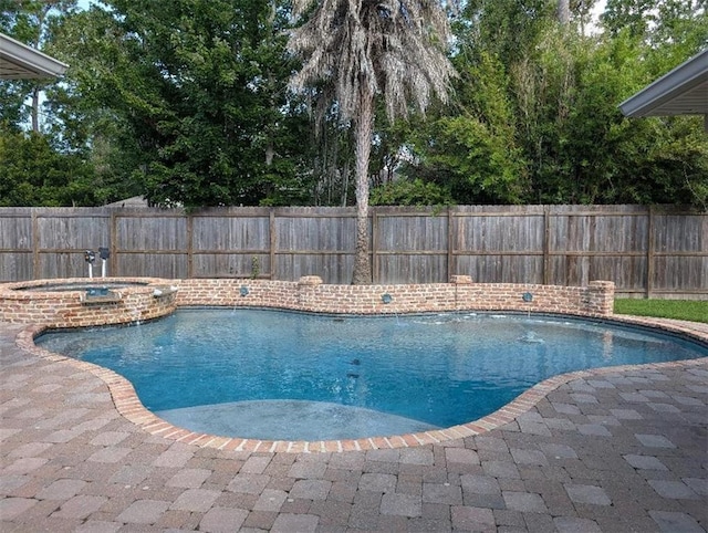 11 Mark Smith Dr, Mandeville, LA 70471 - view of pool with a fenced backyard, a pool with connected hot tub, and a patio