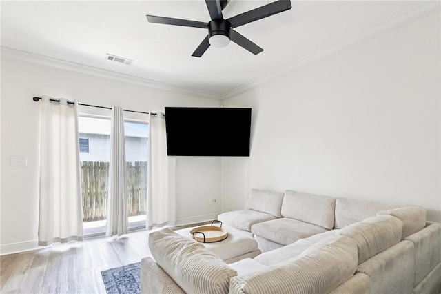 4512 Pontchartrain Dr Unit 2, Slidell, LA 70458 - living area with ornamental molding, wood finished floors, and a ceiling fan