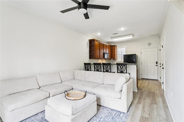4512 Pontchartrain Dr Unit 2, Slidell, LA 70458 - living area with ornamental molding, light wood-type flooring, a ceiling fan, and recessed lighting
