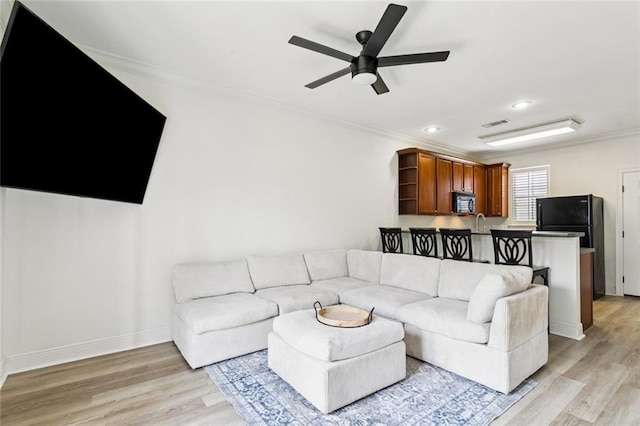 4512 Pontchartrain Dr Unit 2, Slidell, LA 70458 - living area with ornamental molding, light wood-style flooring, a ceiling fan, and recessed lighting