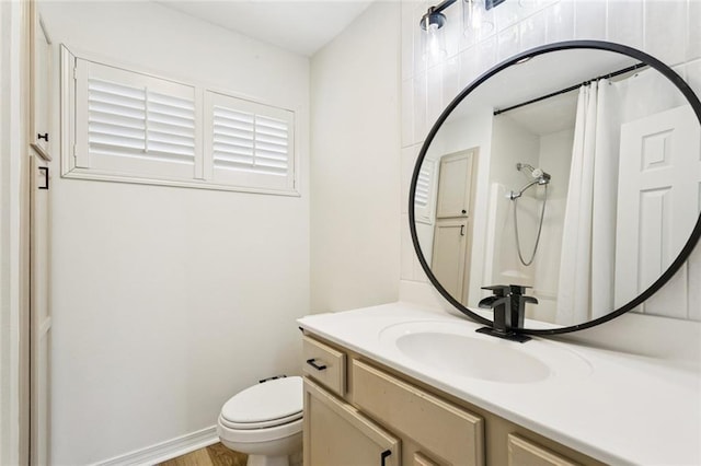 4512 Pontchartrain Dr Unit 2, Slidell, LA 70458 - full bath featuring vanity, a shower with curtain, and wood finished floors
