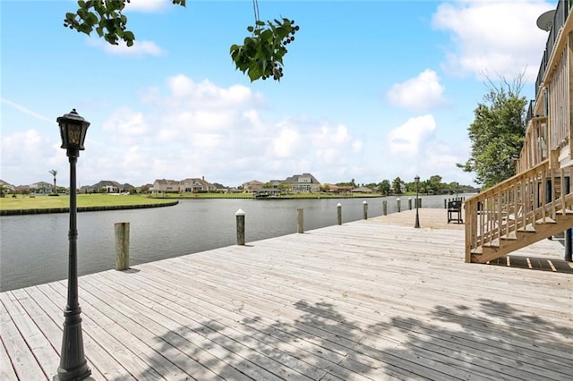 4512 Pontchartrain Dr Unit 2, Slidell, LA 70458 - dock with stairway, a water view, and a residential view