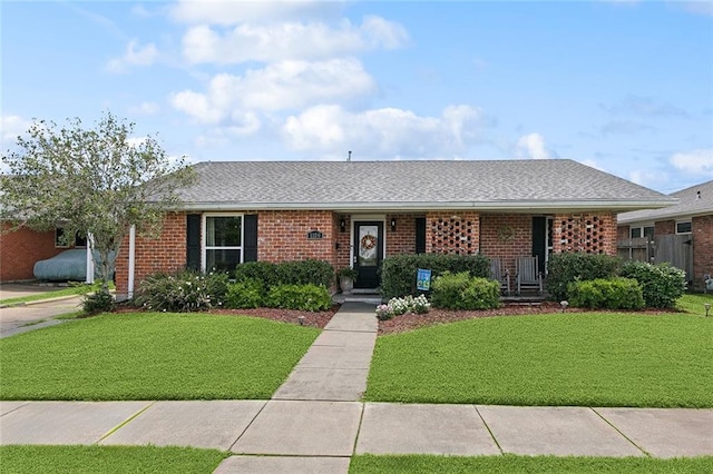 1109 Andrews Ave, Metairie, LA 70005 - single story home featuring a front lawn, roof with shingles, and brick siding