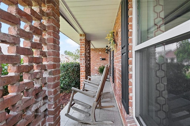 1109 Andrews Ave, Metairie, LA 70005 - view of exterior entry featuring a porch and brick siding