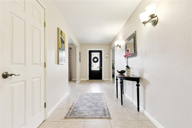 1109 Andrews Ave, Metairie, LA 70005 - foyer with light tile patterned floors and baseboards